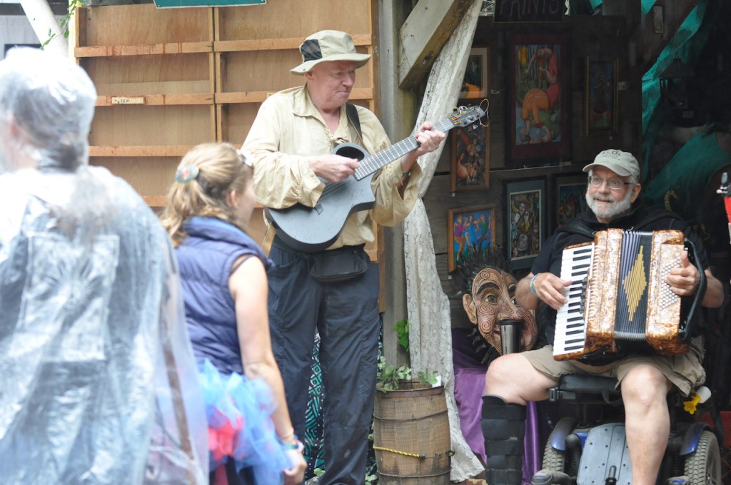 alt="traditional country instruments, a guitar and accordion, being used"